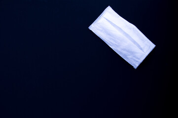 medical mask on a black background. coronavirus quarantine concept. economic decline. Crisis. Copyspace