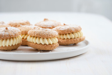 Delicious hazelnut shortbread sandwiches filled with vanila cream. Christmas recipe.