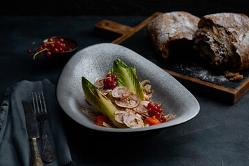 Close up on traditional italian cuisine Vitello tonnato. A dish with pickled veal with tuna cream...