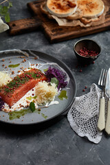Gourmet dish. Smoked salmon with vegetables. Salmon dish for restaurant