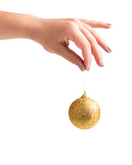 Woman holding golden xmas ball in hand, isolated on white