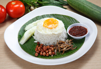 Nasi lemak is a Malay fragrant rice dish cooked in coconut milk and pandan leaf. It is commonly found in Malaysia, where it is considered the national dish.
