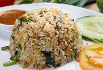 fried rice-Fried rice is a dish of cooked rice that has been stir-fried in a wok or a frying pan and is usually mixed with other ingredients such as eggs, vegetables, seafood, or meat.