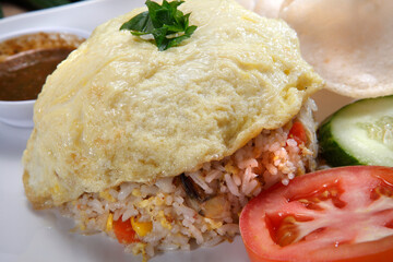 fried rice-Fried rice is a dish of cooked rice that has been stir-fried in a wok or a frying pan and is usually mixed with other ingredients such as eggs, vegetables, seafood, or meat.