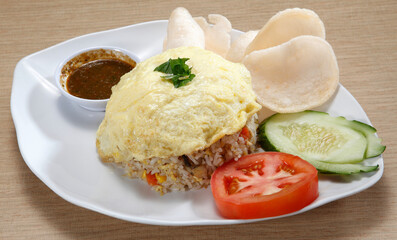 fried rice-Fried rice is a dish of cooked rice that has been stir-fried in a wok or a frying pan and is usually mixed with other ingredients such as eggs, vegetables, seafood, or meat.