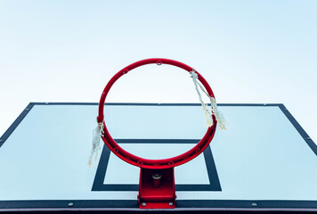 Fototapeta na wymiar Red basketball hoop with white table. Copy space