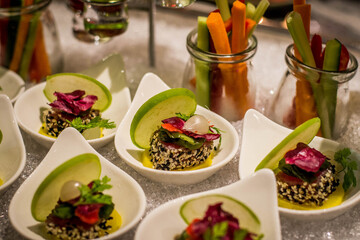 a buffet spread full of bite sized delicious canapes on a table