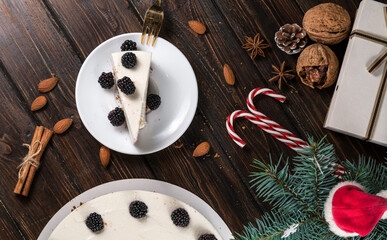 New Year's cheesecake with berries on a wooden table.