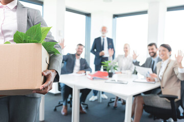 Woman holding a carton of belongings