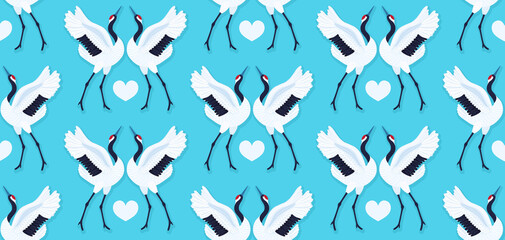 Fototapeta premium Seamless pattern with pair of red crowned cranes and heart. Repeating blue background with dancing East Asian birds. Love and romance. Valentine's day design. Wallpaper, fabric, wrapping paper. Vector