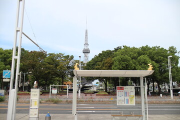 A bus stop and Nagoya TV Tower which appear of  golden dolphins