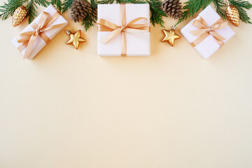 Christmas flat lay background with fir tree, present box and decorations. Free space , top view