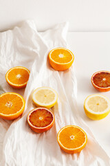 Lime, lemon and orange slices on white background