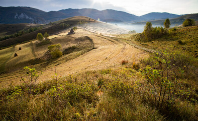 rural Romania beautiful foggy morning landscape in Apuseni mountains