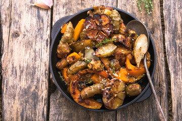 Fried Jerusalem artichoke with pumpkin  and seasonings