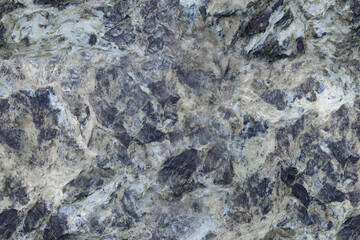 Seamless pattern of rough abstract textured surface of gray and blue stone. Cracked stone background