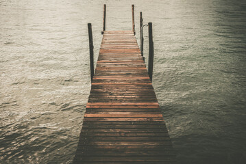 Obraz premium Rustic Wooden Pier on the Lake