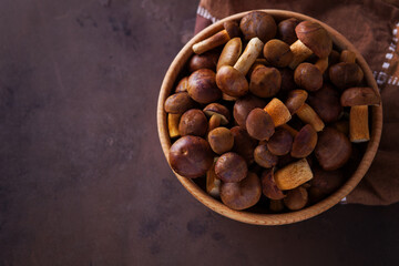 wooden bowl full of fresh mushrooms