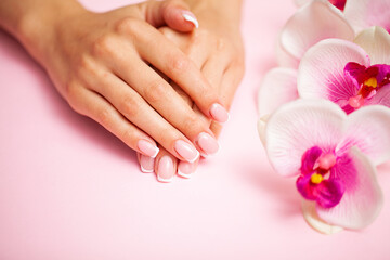 Young woman after getting professional manicure in beauty salon