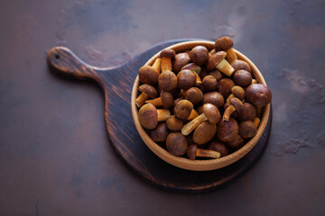 wooden bowl full of fresh mushrooms