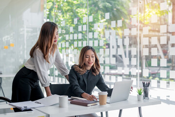 Happy asian businesswoman working together in the office.