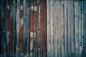 texture from wooden narrow old planks with peeling paint