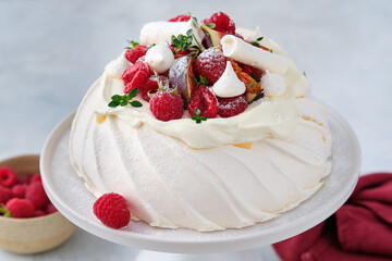Meringue dessert Pavlova with fresh figs and raspberries. Christmas dessert.