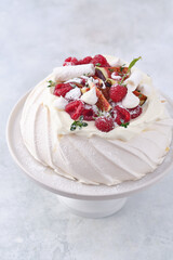 Meringue dessert Pavlova with fresh figs and raspberries. Christmas dessert.