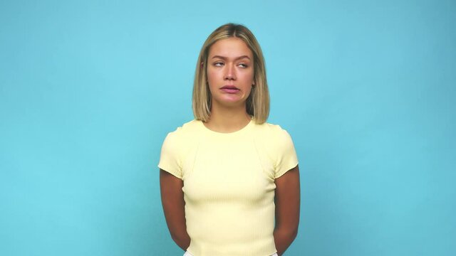 Young blonde caucasian woman confused, feels doubtful and unsure