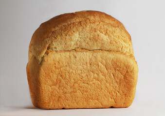  A loaf of bread on a white background. side view
