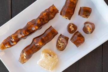 Cevizli sucuk made by dipping a string with walnuts into a grape molasses mixture. Churchkhela, Pestil, Cevizli Sucuk, Walnut sausage