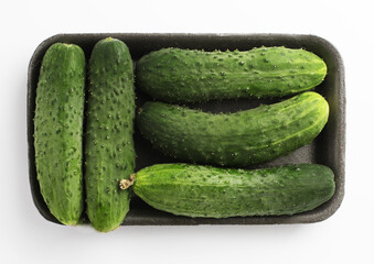 Packing of fresh cucumbers. Isolated on a white background. Top viev.
