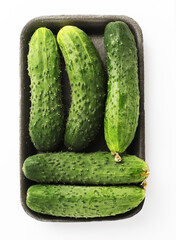 Packing of fresh cucumbers. Isolated on a white background. Top viev.
