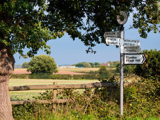 A directional signpost on a country lane at Ellerdine Heath in Shropshire, UK. 