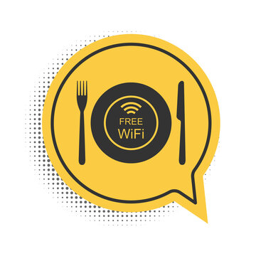 Black Restaurant Free Wi-Fi zone icon isolated on white background. Plate, fork and knife sign. Yellow speech bubble symbol. Vector.