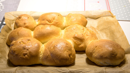 fresh, hand-made rolls on a baking tray immediately after baking