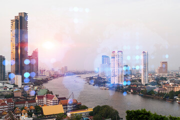 World planet Earth map hologram over panorama city view of Bangkok, Asia. The concept of international connections and business. Multi Exposure.