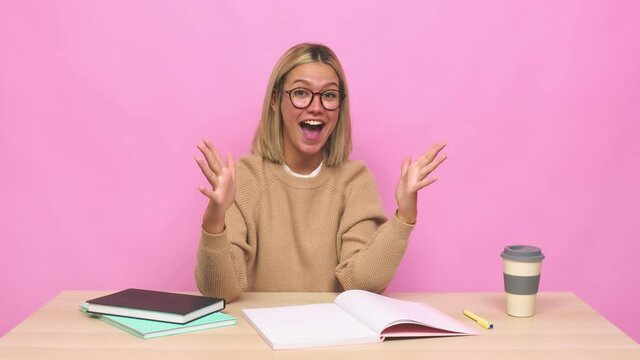 Young blonde caucasian woman celebrating a victory or success, he is surprised and shocked