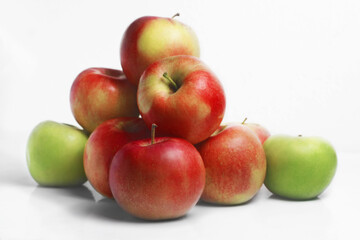 Fresh red epples on white background. As a pyramid.  Side view. Group