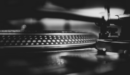 Fototapeta na wymiar Black and white beautiful close up view of a professional DJ turntables