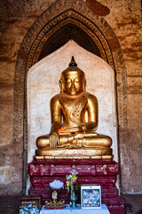 Buddha in a pagoda of Bagan in Myanmar, formerly Burma, a world heritage site.