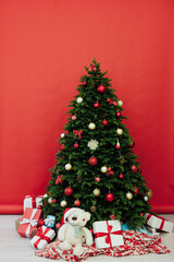 Christmas tree pine with gifts new year decor garland interior of the holiday house December