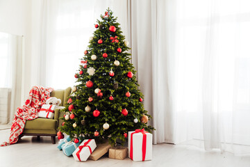 Christmas tree pine with gifts new year decor garland interior of the holiday house December
