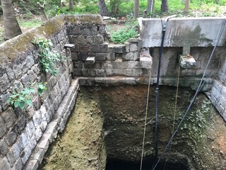 Water well used by Stone boulders in flemish bond construction for agricultural or farming purpose and bucket rope facilities to lift