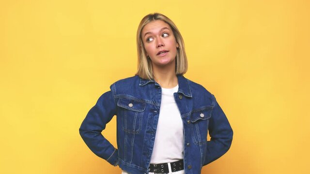 Young blonde caucasian woman confused, feels doubtful and unsure