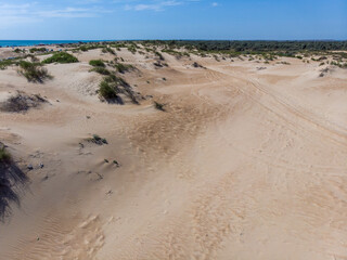 flight over the white sand dunes of the desert