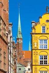 Pointed towers of St. Mary’s Basilica - Bazylika Mariacka - in back of Kramarska street in the historic old town city center quarter of Gdansk, Poland