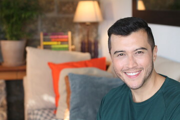 Young ethnic man smiling at home
