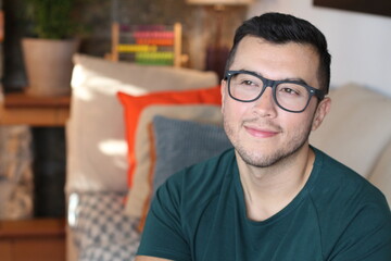 Obraz premium Young ethnic man smiling at home