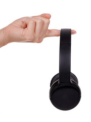 Hand with Wireless black headphones. Isolated on white background.